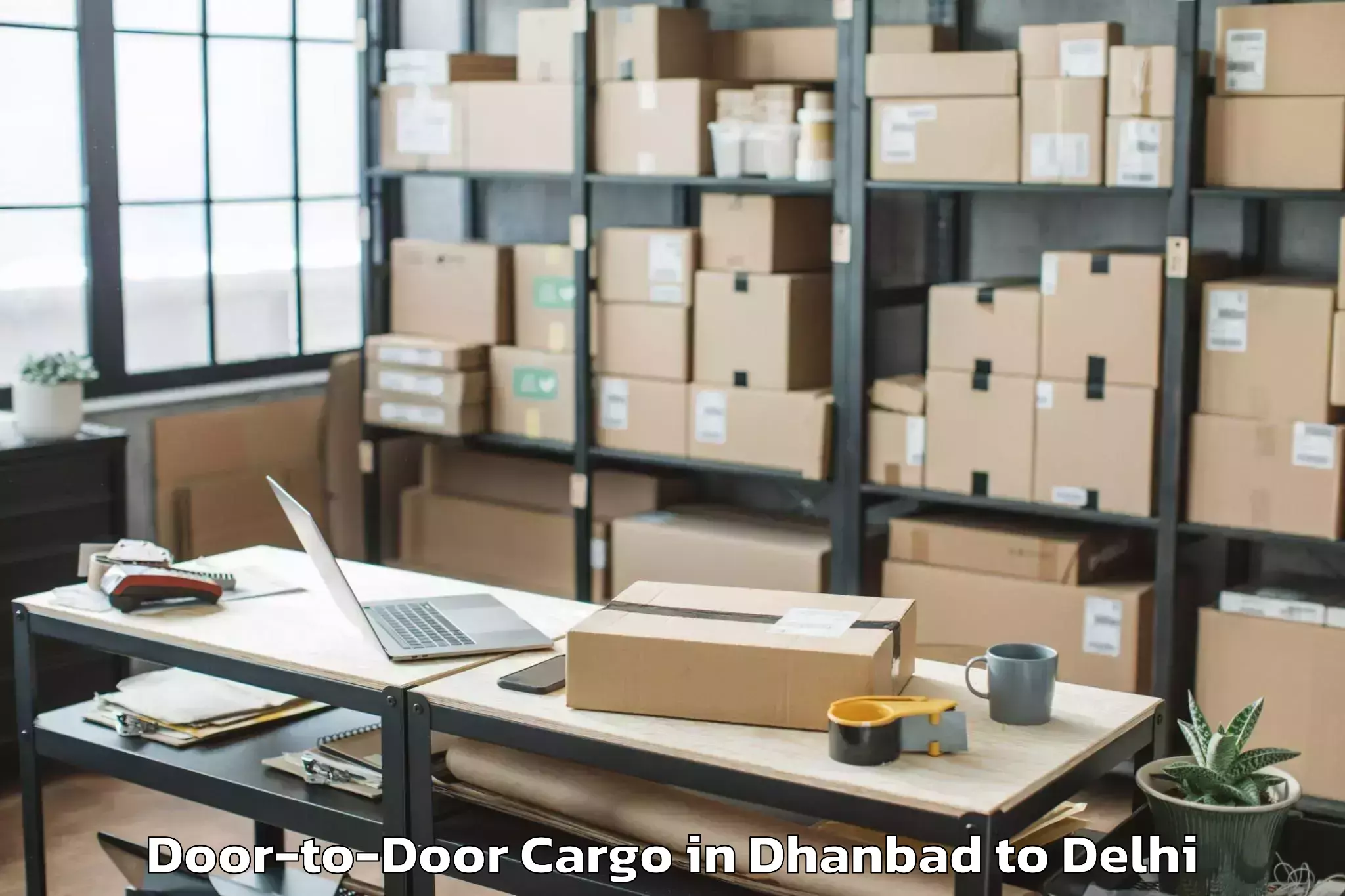 Expert Dhanbad to Chanakya Puri Door To Door Cargo